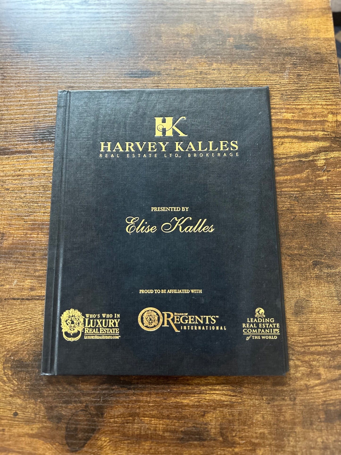 White hard cover with full colour crest